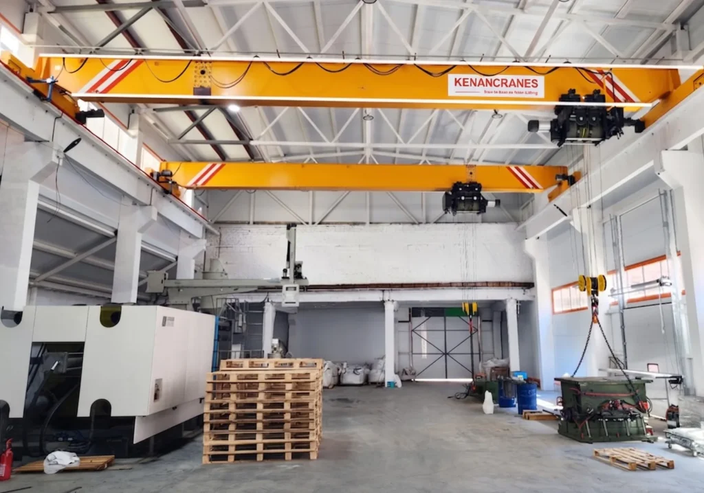 Indoor Yellow Overhead Bridge Crane in a Warehouse